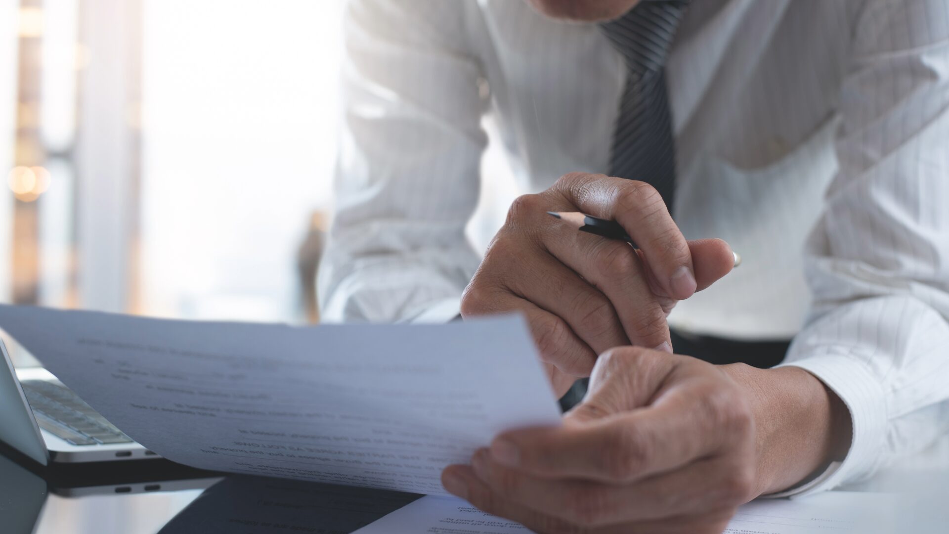 professionals reviewing contracts