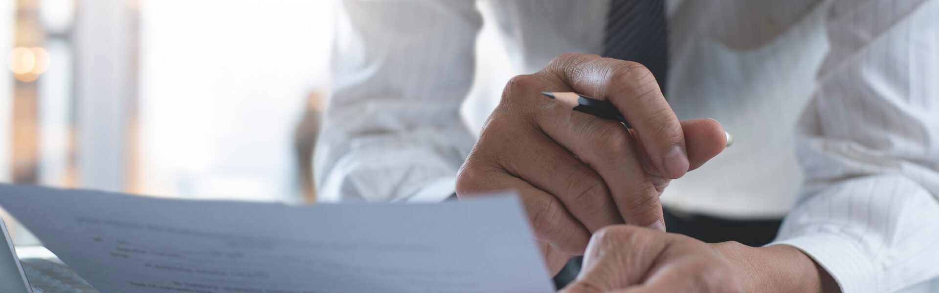 professionals reviewing contracts